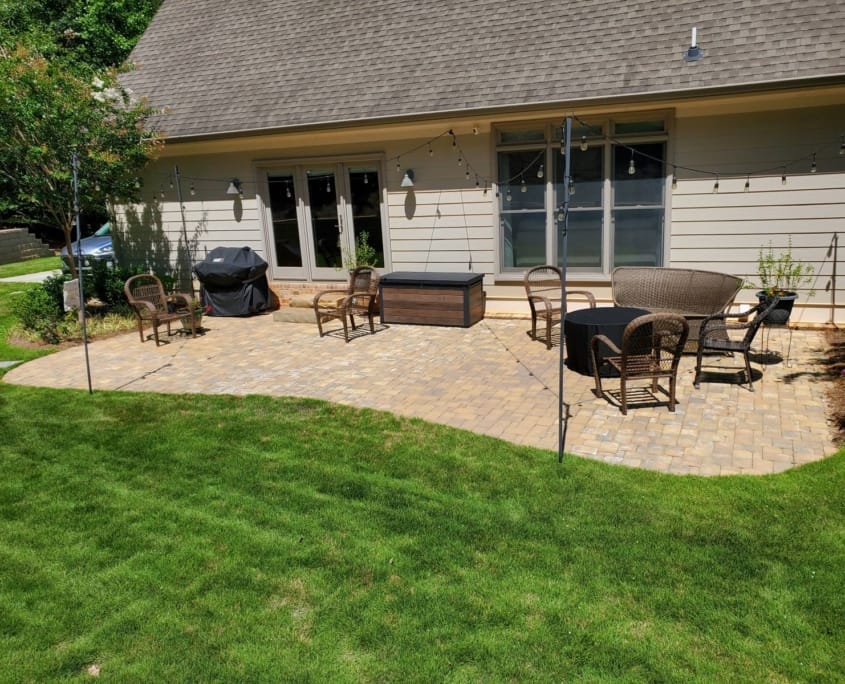 backyard patio with string lights and seating