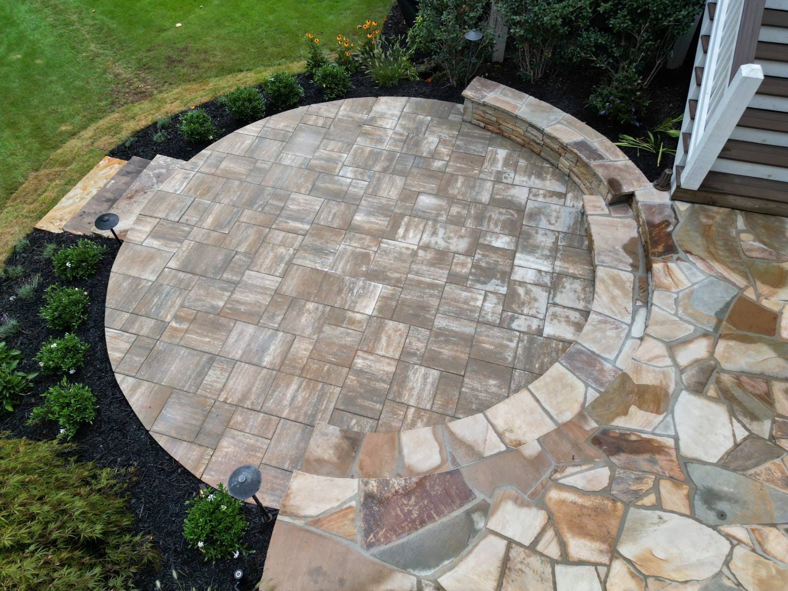 Patio surrounded by new sod with stone steps